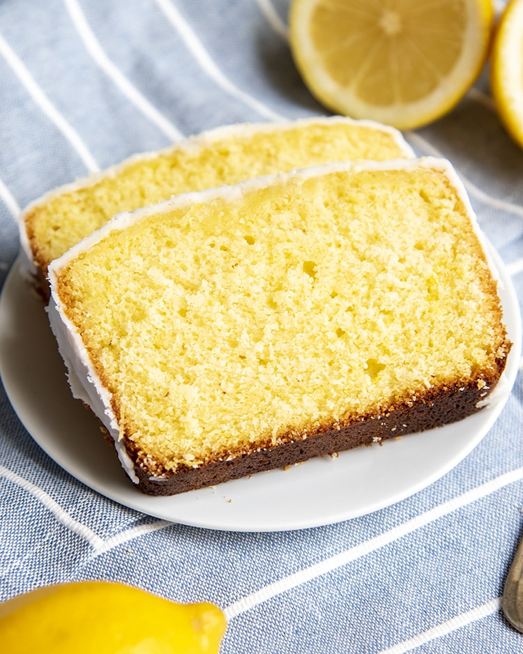 Two pieces of lemon sweet bread on a plate.