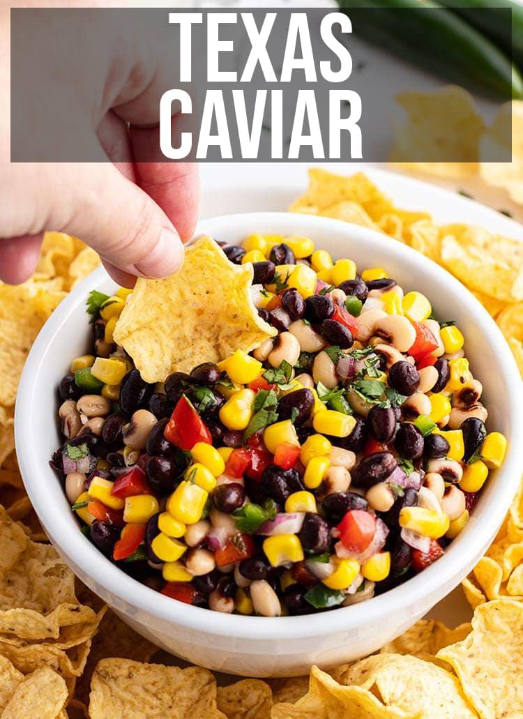 A bowl of chip dip made with black beans, corn, red pepper, and more.