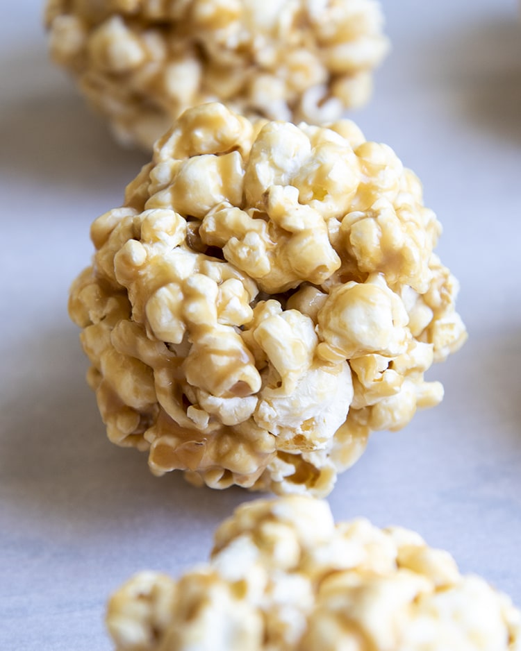 Caramel popcorn formed into a ball.