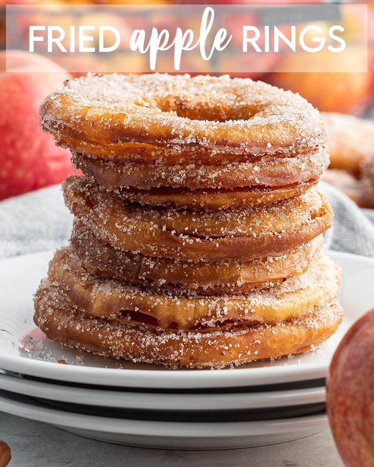 A stack of fried apple rings on a plate with text overlay for pinterest.