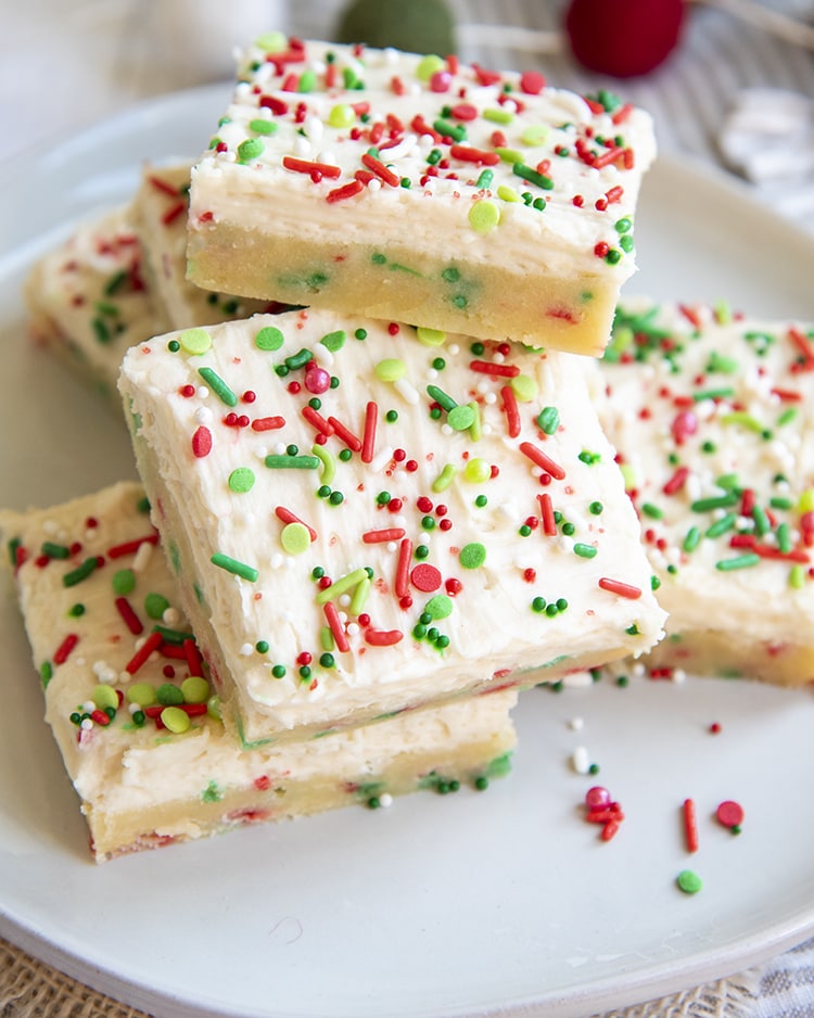 A stack of Christmas Sugar Cookie Bars on a white plate.