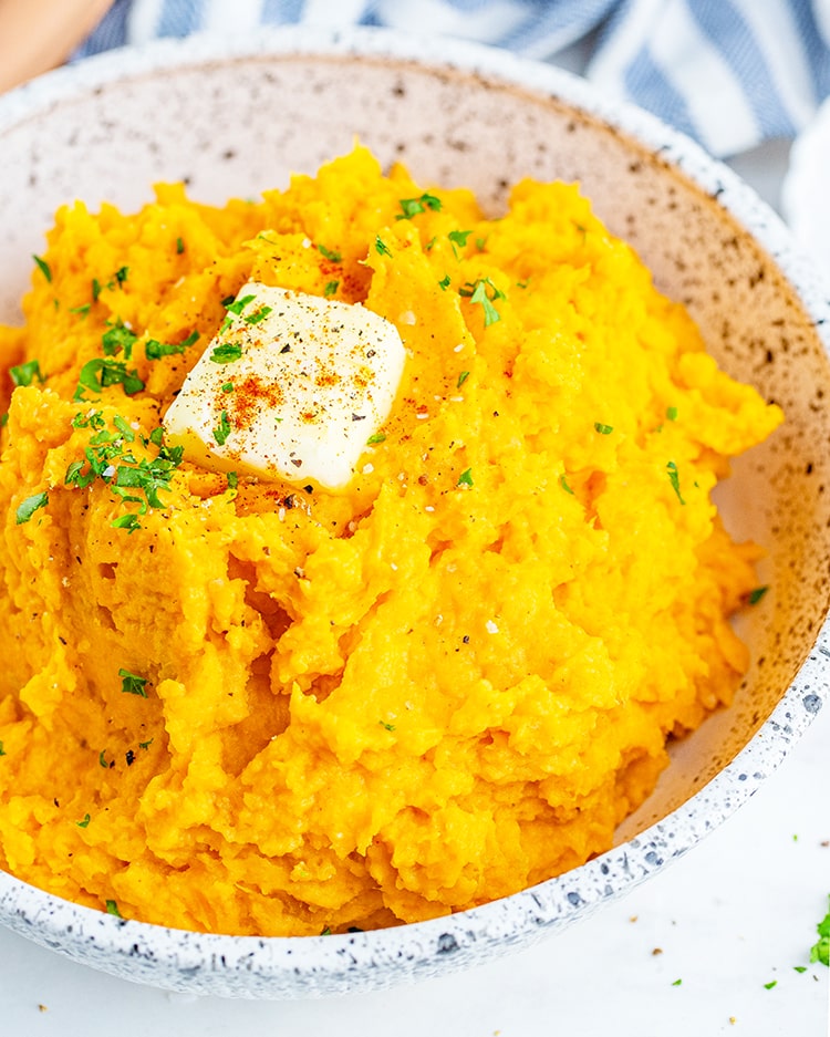 A shot of a bowl of savory mashed sweet potatoes.