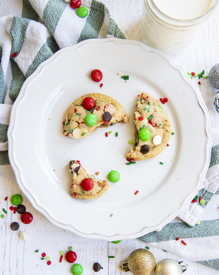 Pieces of Santa's chocolate chip cookies left on a plate.