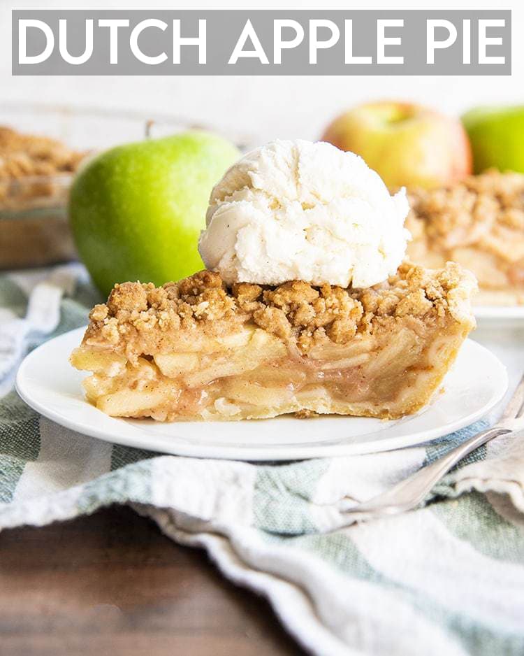 A slice of apple pie on a white plate, topped with vanilla ice cream, with apples behind it with a text overlay saying Dutch Apple Pie.