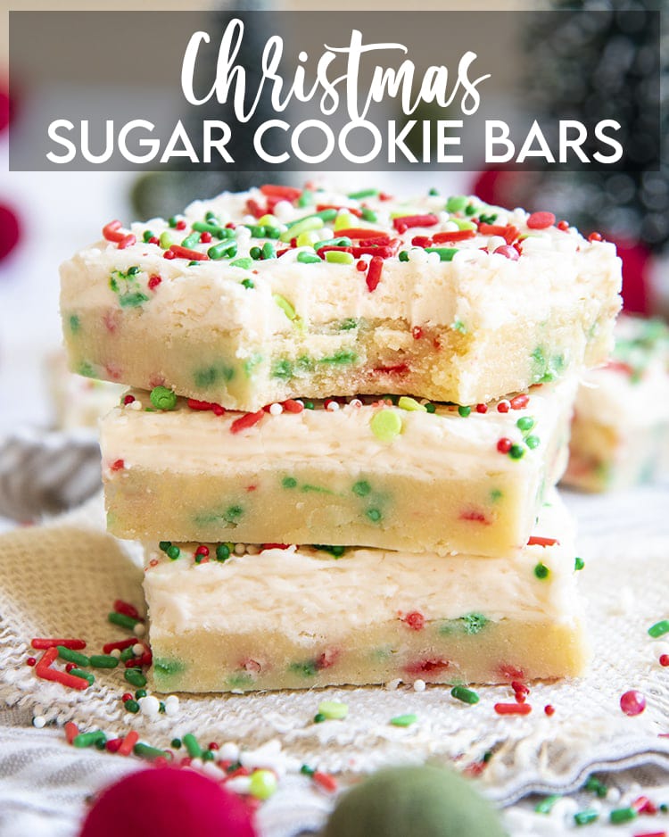 A stack of Christmas sugar cookie bars with red and green sprinkles in the bars and on top of the frosting.