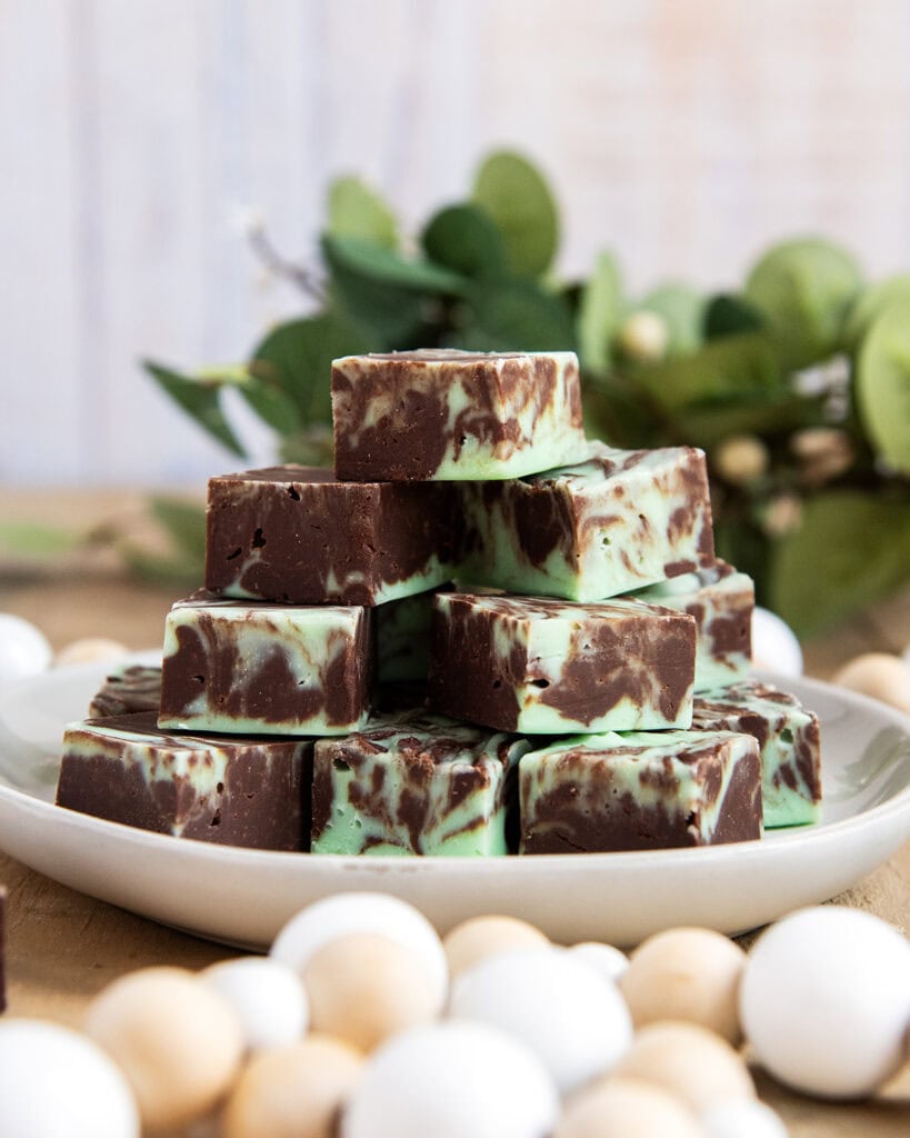 A plate of mint fudge with chocolate and green fudge swirled together. 