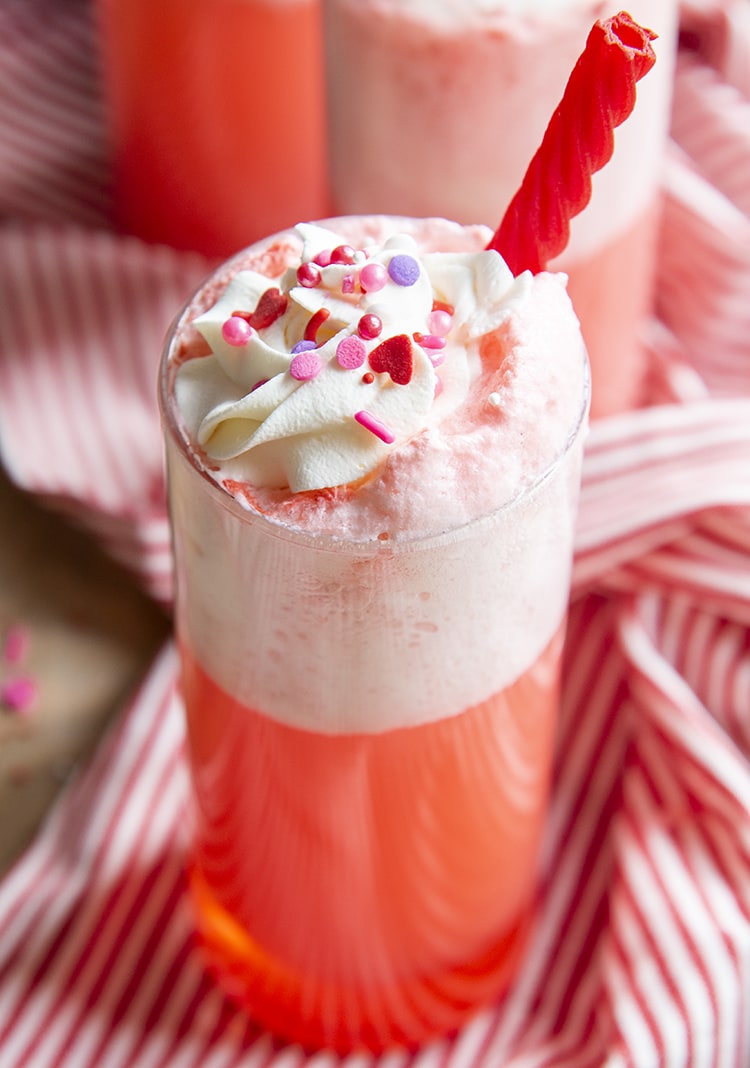 A close up of a glass of a Strawberries and cream float.