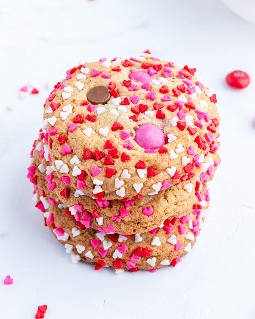 A stack of three Valentine M&M cookies.