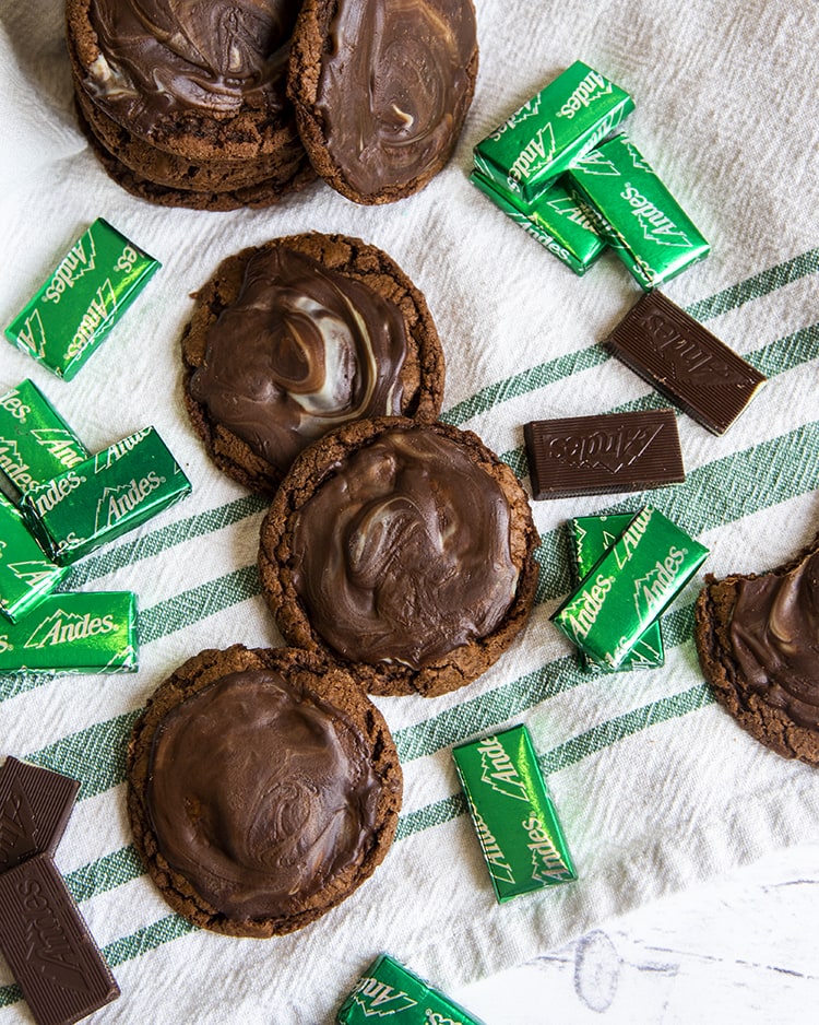 Andes mint chocolate cookies on a white and green towel.