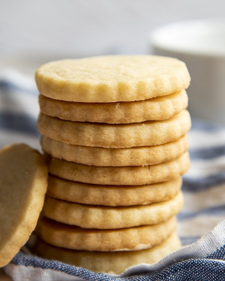 A stack of shortbread cookies with a crimped edge.