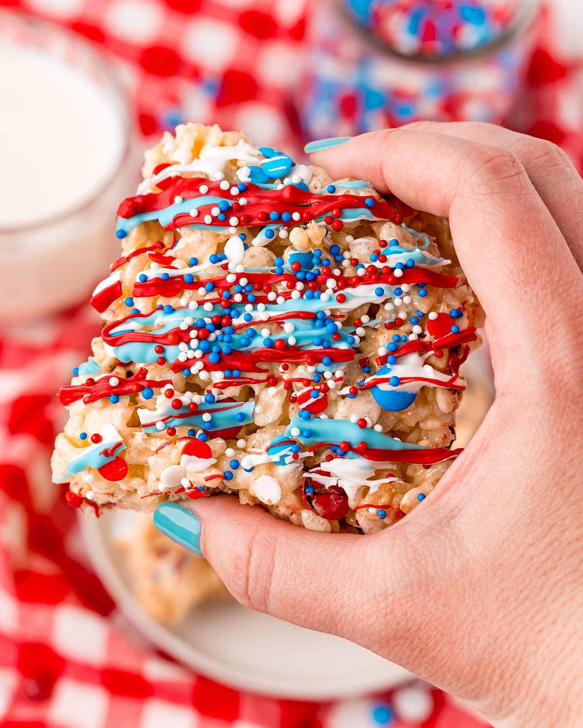 A hand holding a 4th of July Rice Krispie Treat