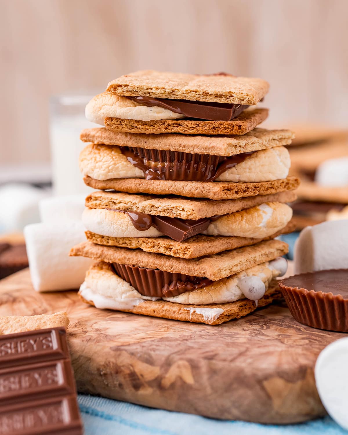 A stack of s'mores made with hershey chocolate, and reeses cups chocolate.