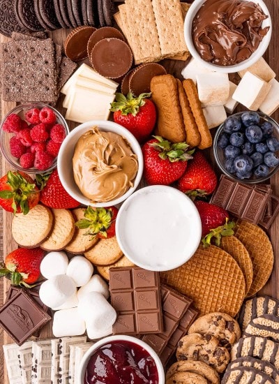 An overhead shot of a s'mores charcuterie board full of s'mores fixins.