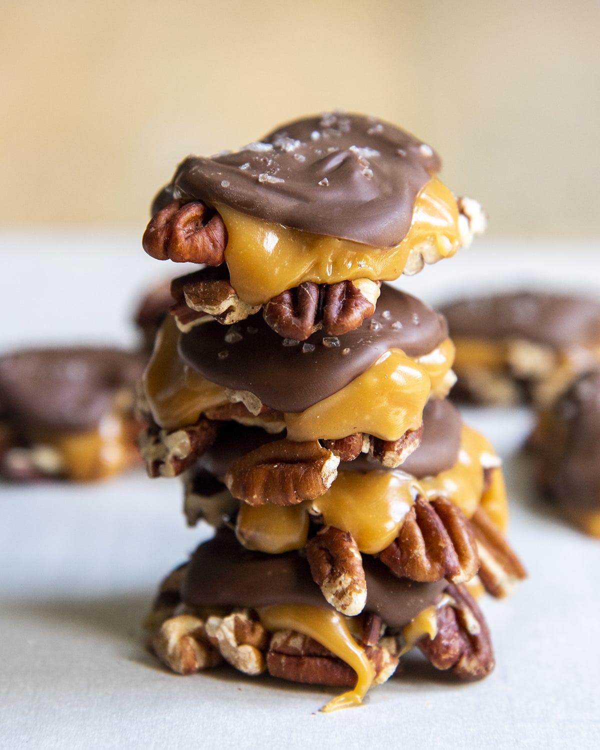 A stack of chocolate turtles, stacked 4 high.