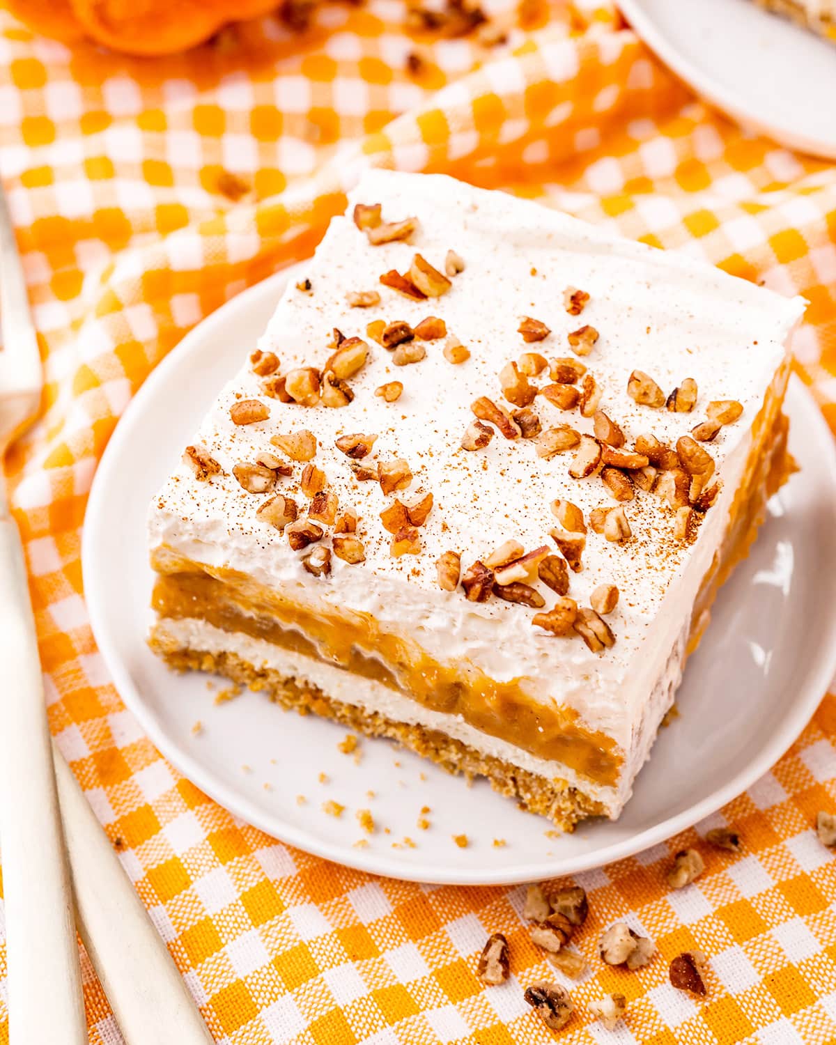 A piece of pumpkin delight on a white plate.