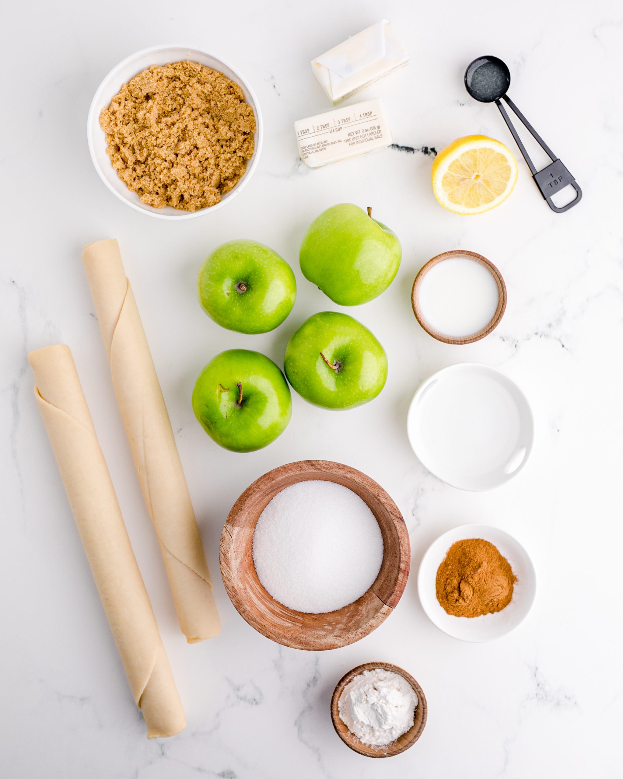 A photo of all the ingredients needed to make a classic apple pie.