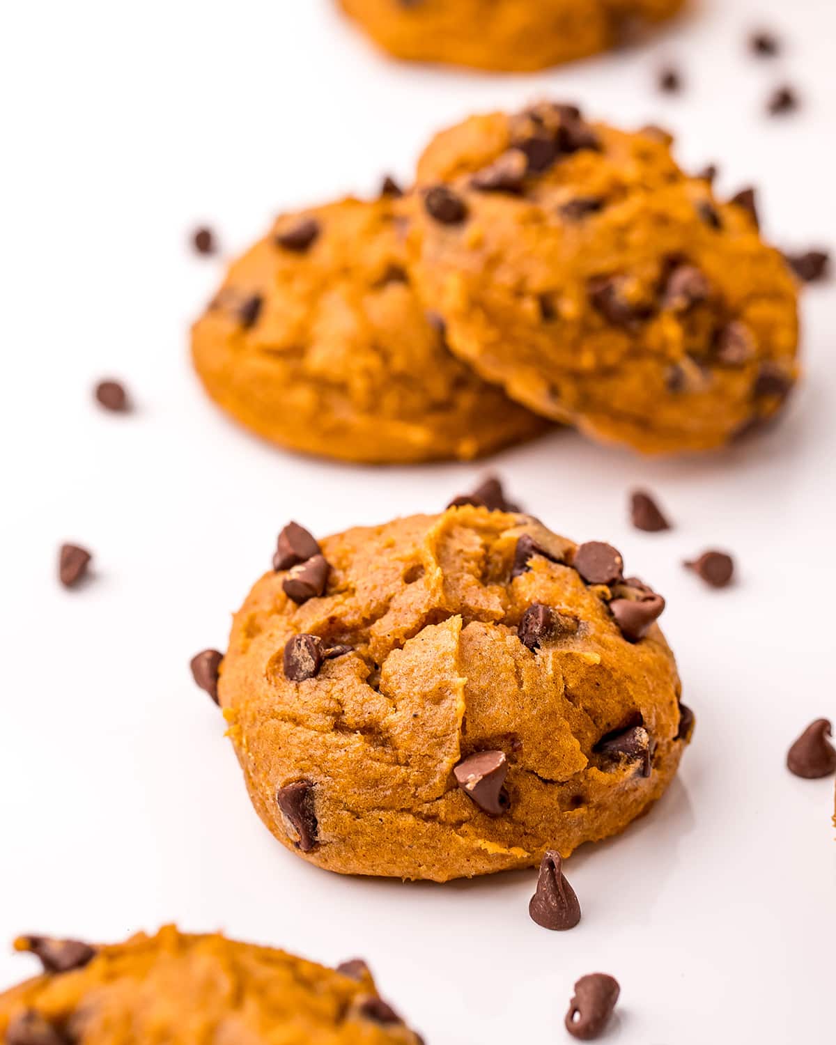 Pumpkin cake mix cookies on a white background.