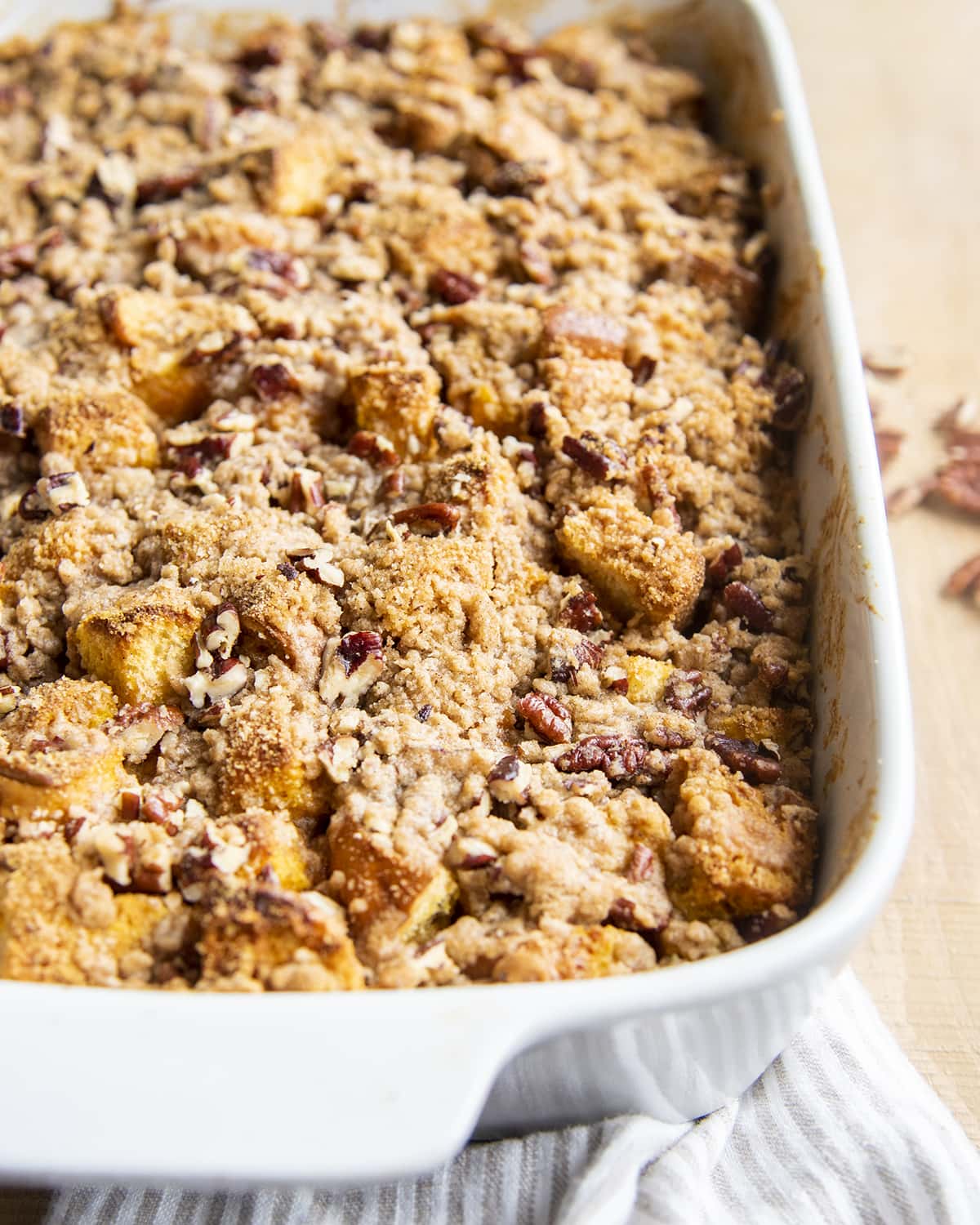 French toast casserole in a baking dish showing just the streusel topping.