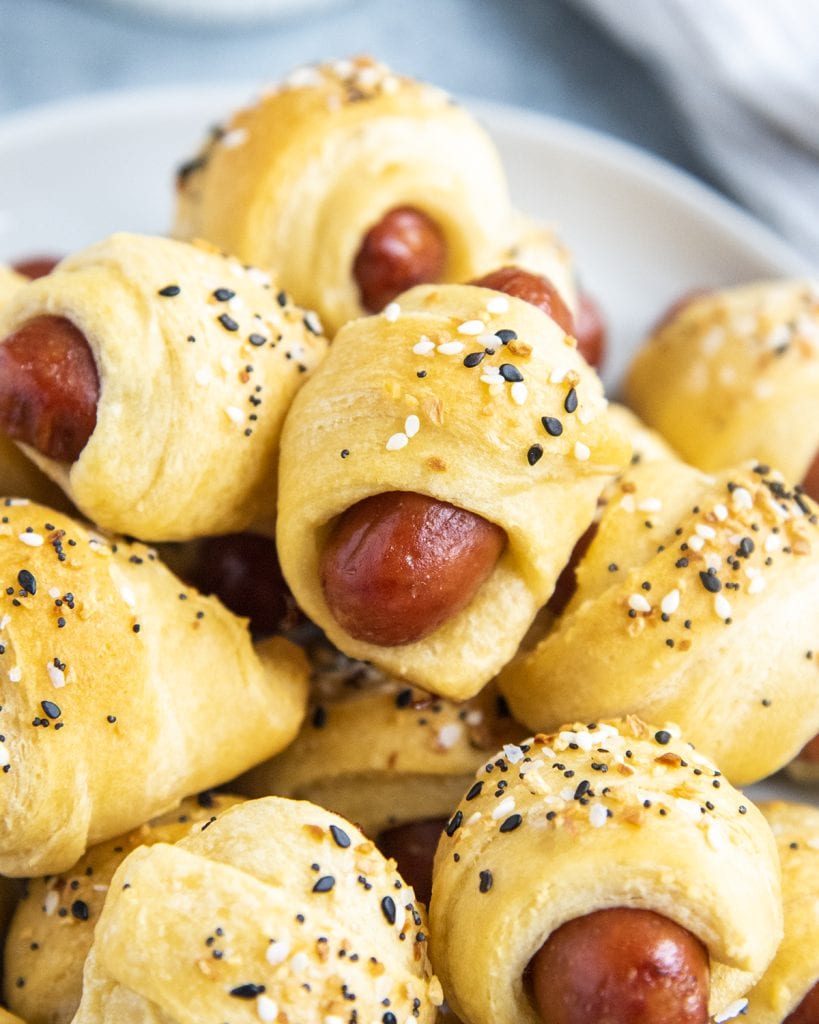 A pile of everything bagel pigs in a blanket.