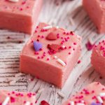 A piece of strawberry fudge topped with Valentine sprinkles.