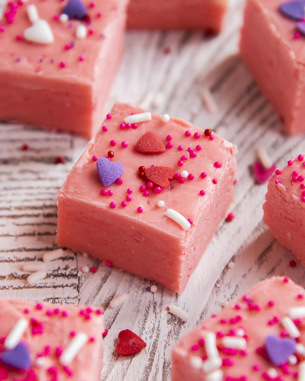 A piece of strawberry fudge topped with Valentine sprinkles.