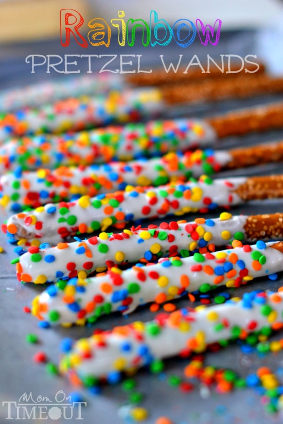 Pretzel sticks dipped in white chocolate and sprinkled with rainbow colored sprinkles.