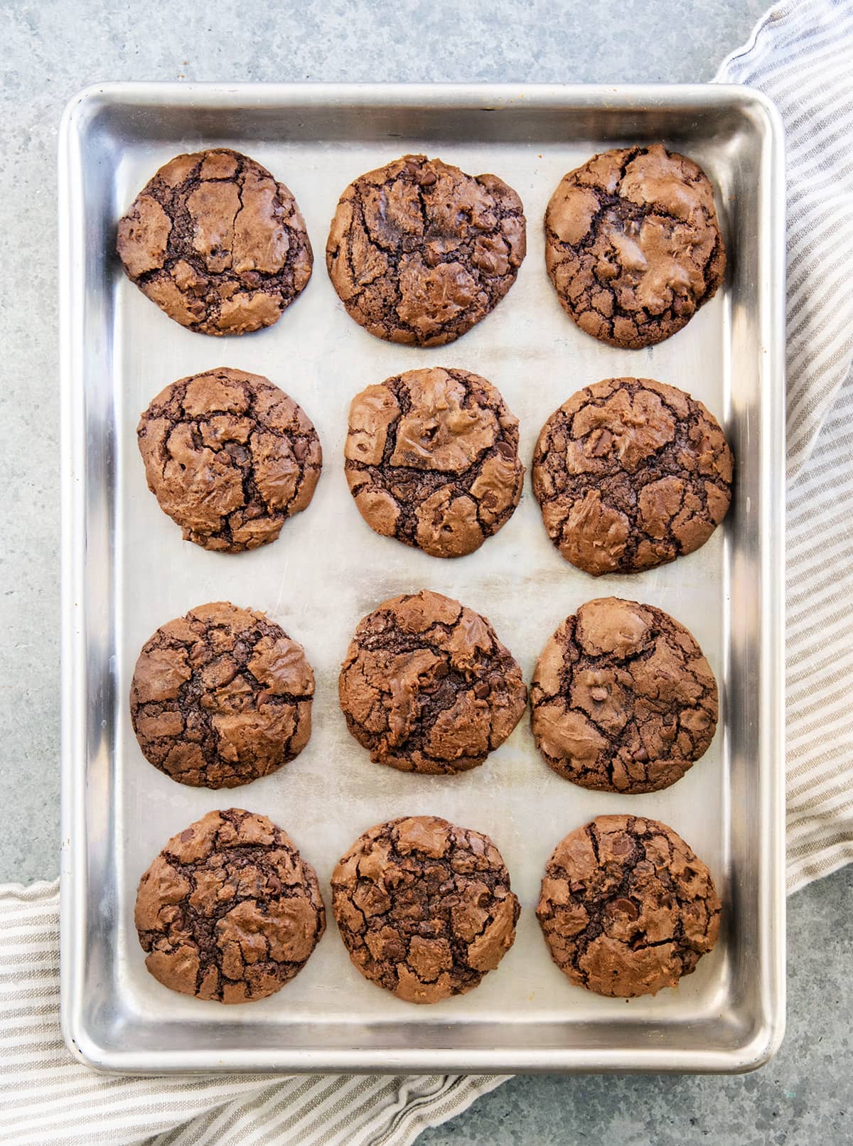 Brownie cookies on a metal baking sheet.