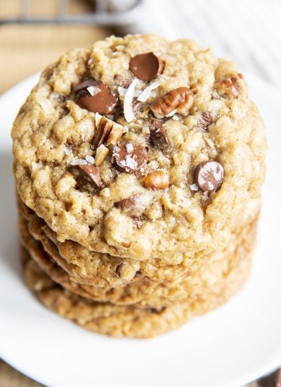 An overhead photo of a stack of oatmeal chocolate chip cookies with pecans and coconut.