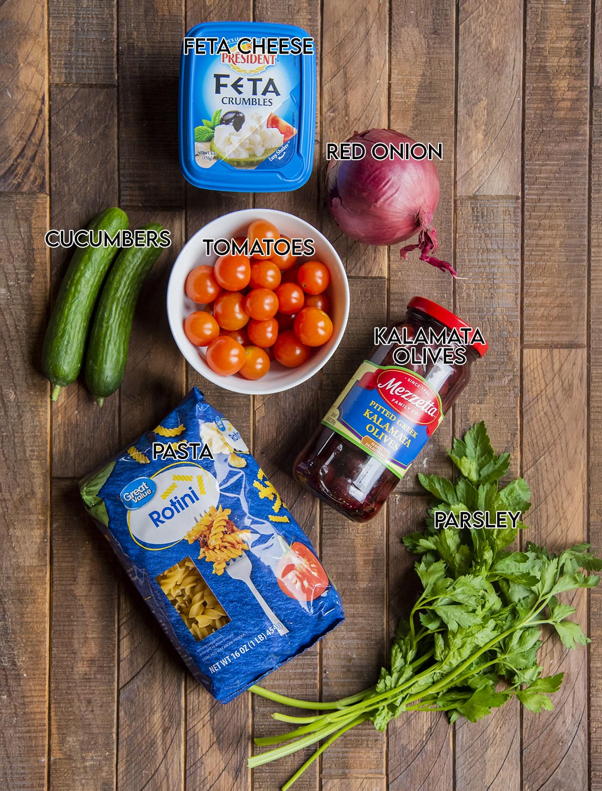 The ingredients needed to make greek pasta salad. 