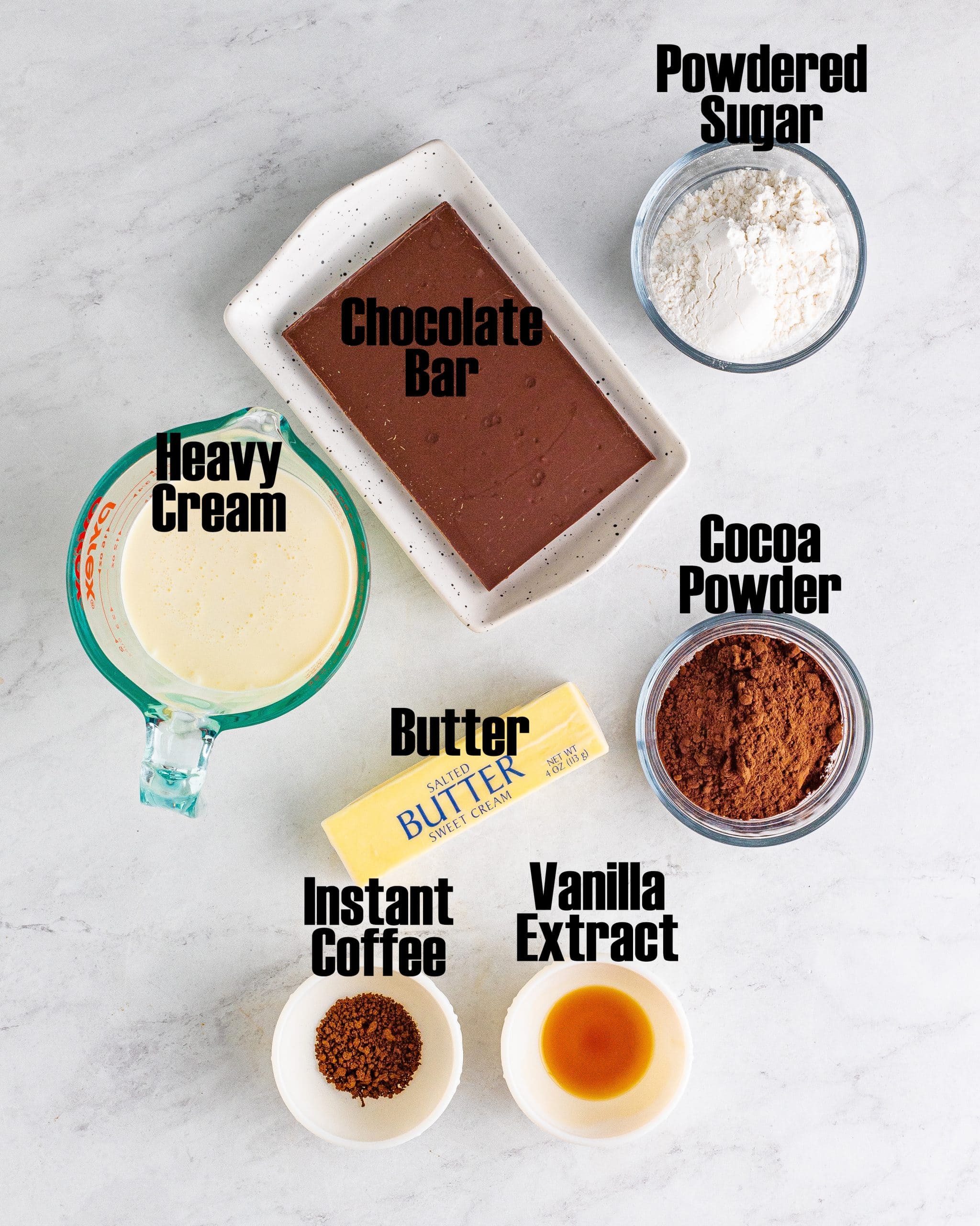 An overhead photo of the ingredients needed to make chocolate mousse, with labels on them.