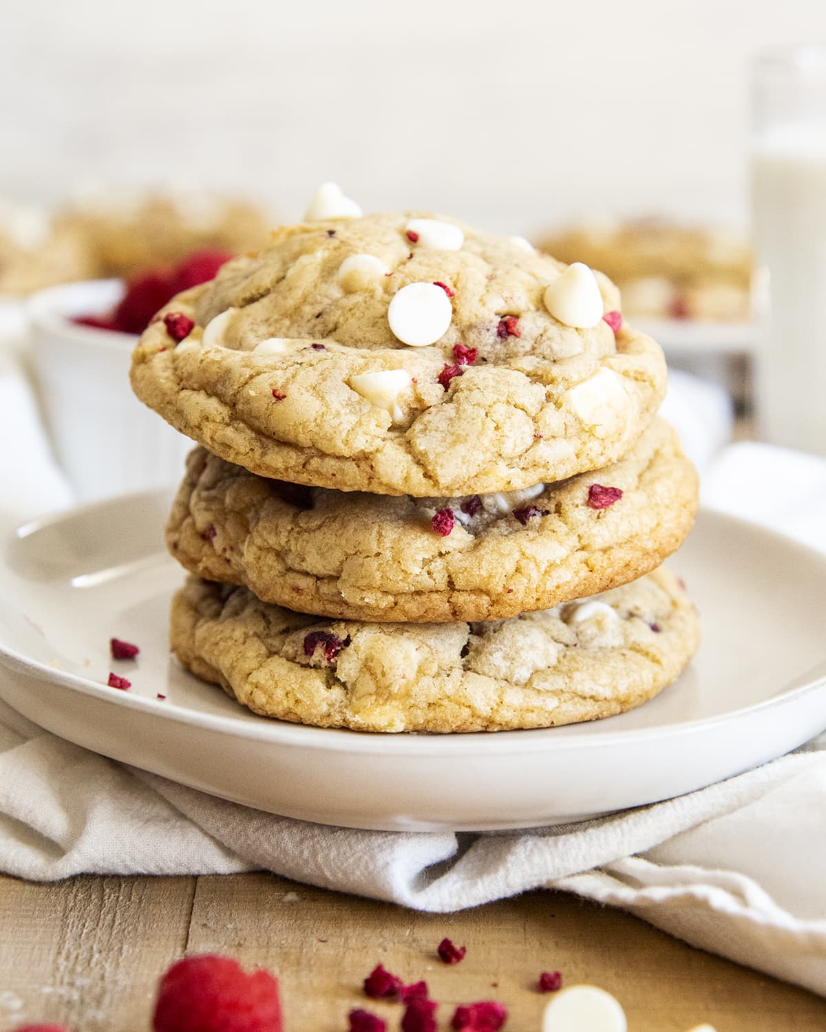 A stack of three white chocolate raspberry cookies.