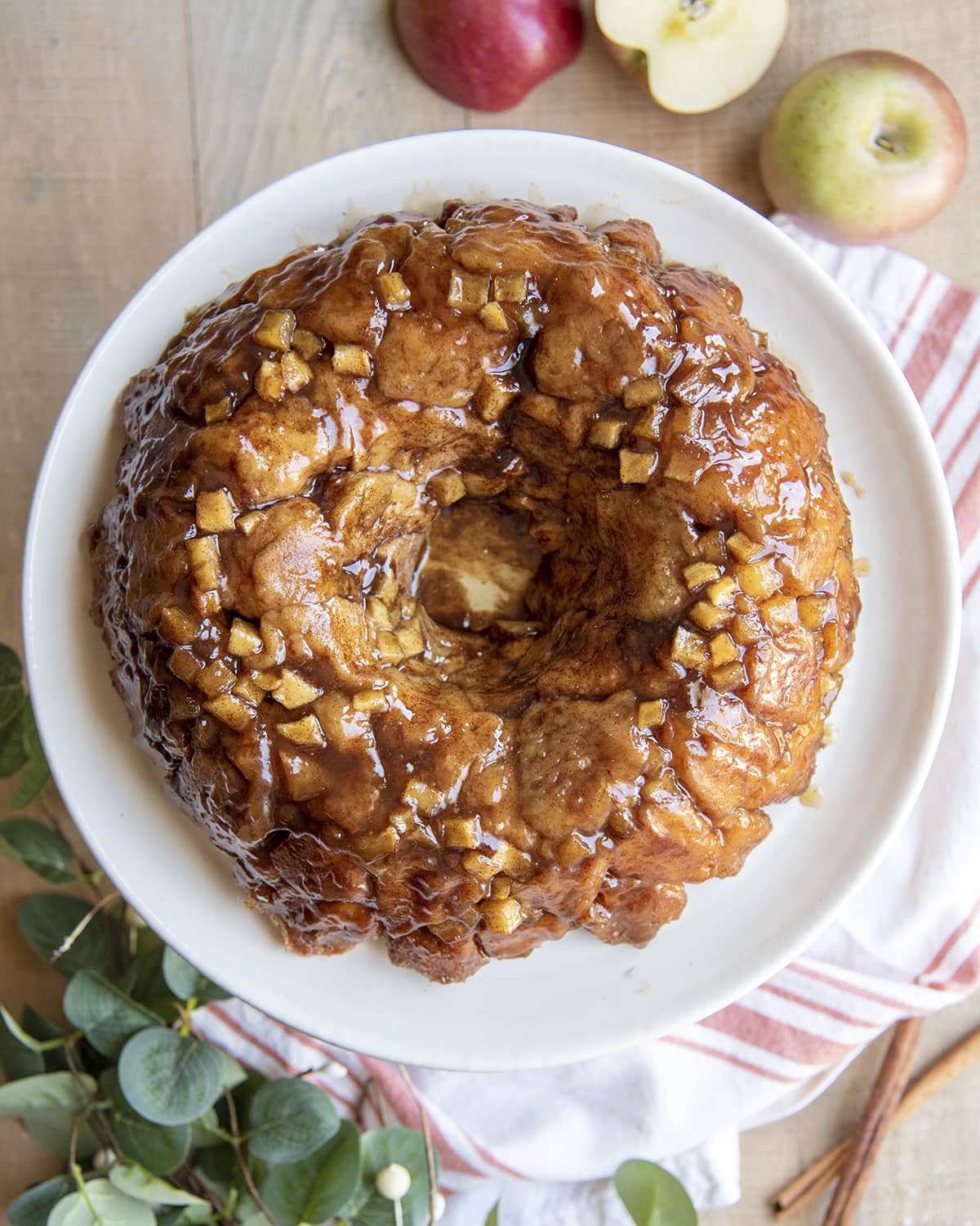 An overhead photo of a bundt shaped apple monkey bread covered in caramel.