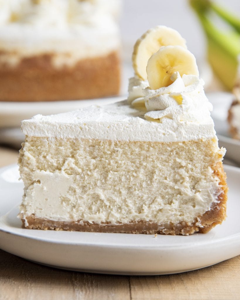 A close up of a slice of banana cheesecake on a plate.