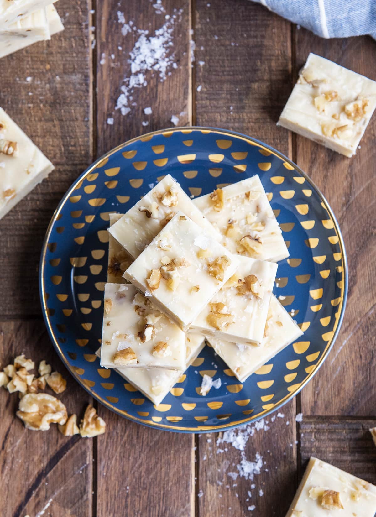 An overhead photo of a plate of maple walnut fudge pieces.
