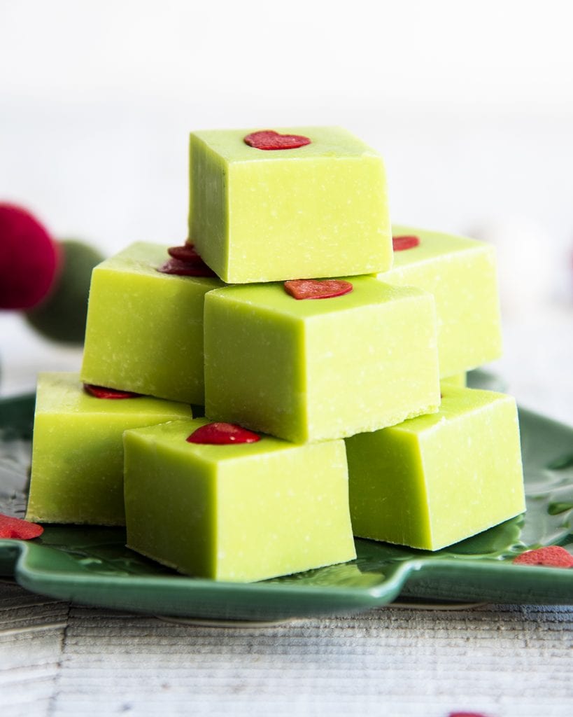 A pile of green christmas fudge on a plate.