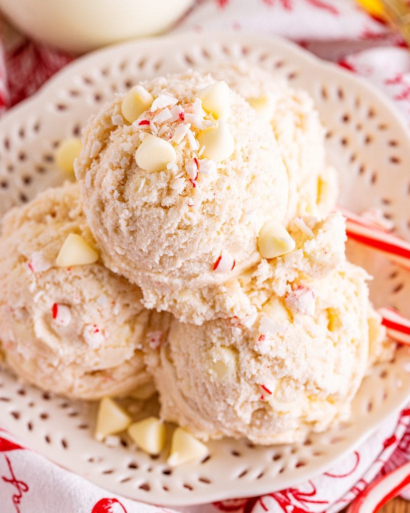 Scoops of peppermint candy cane cookie dough on a white plate.