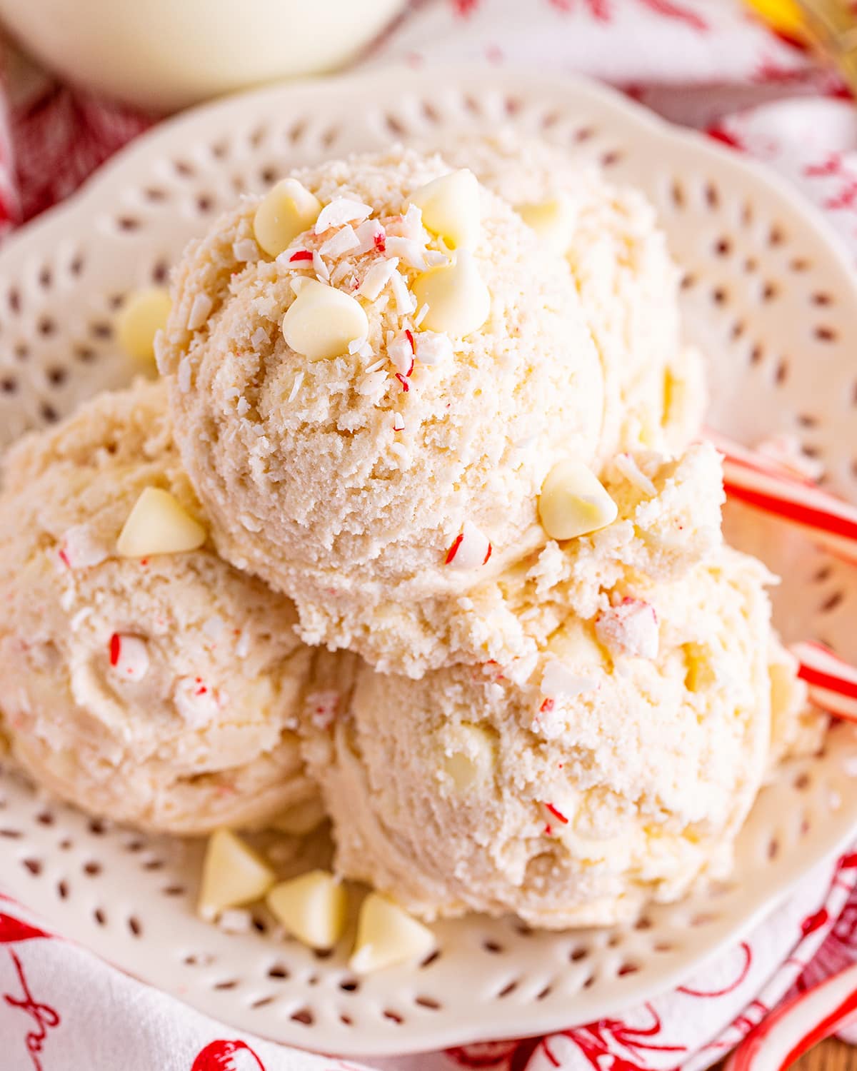 Scoops of peppermint candy cane cookie dough on a white plate.