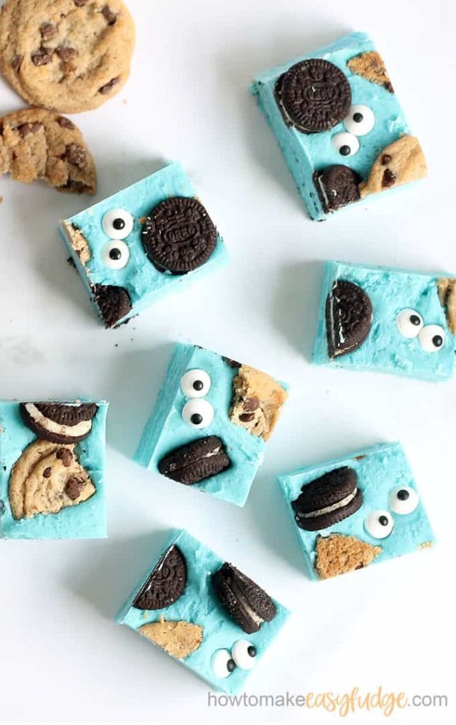 An overhead photo of blue fudge pieces loaded with chocolate chip cookies. 