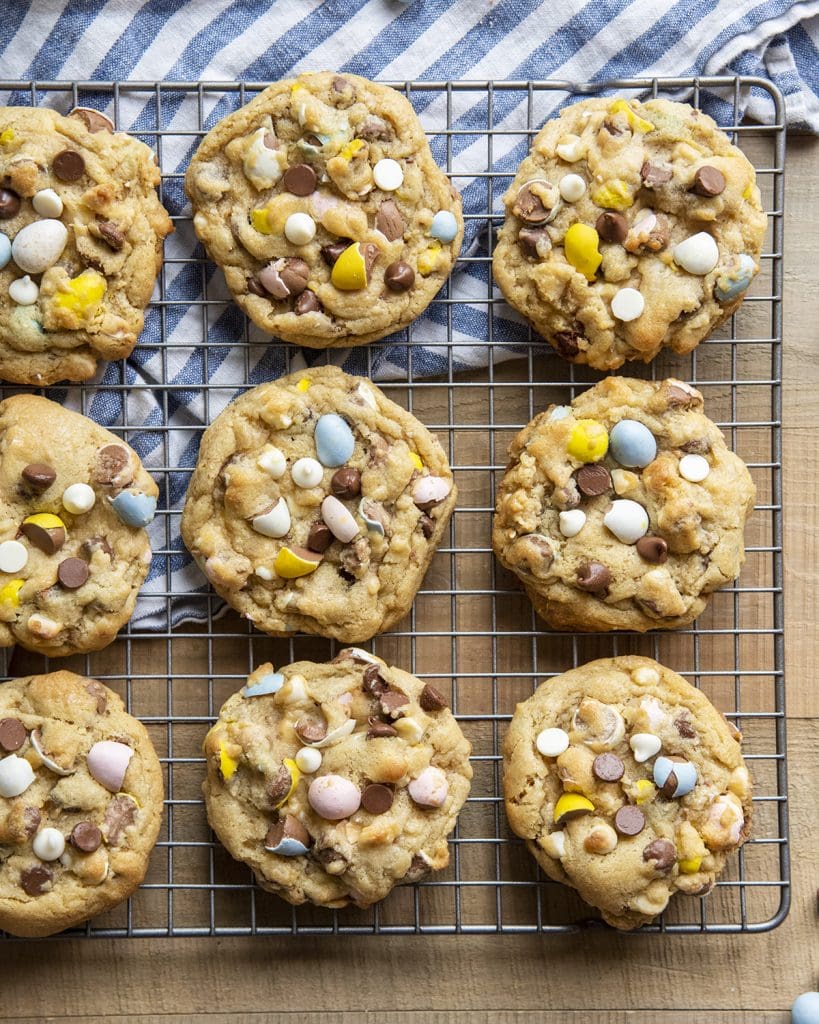 Cadbury egg cookies on a cooling rack, shot from above.
