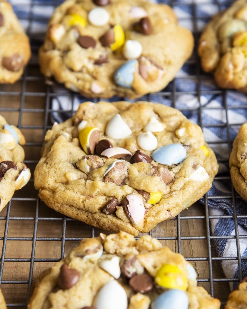 A close up of rows of Cadbury mini egg and chocolate chip cookies.