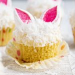 An Easter Bunny Cupcake topped with shredded coconut and marshmallow bunny ears.