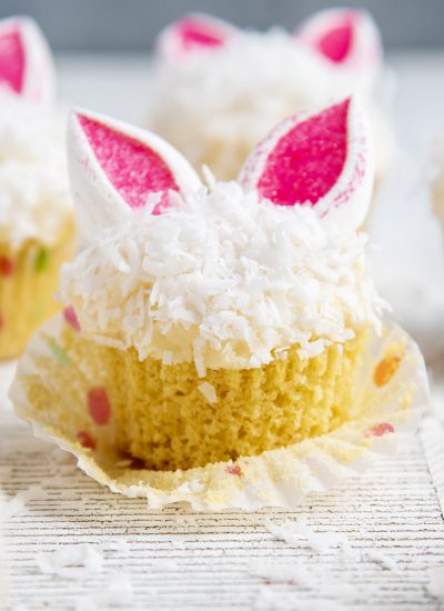 An Easter Bunny Cupcake topped with shredded coconut and marshmallow bunny ears.