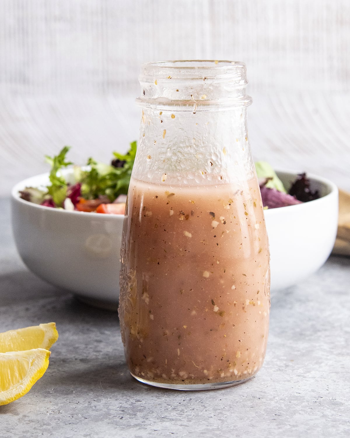 A bottle of red wine vinaigrette dressing.