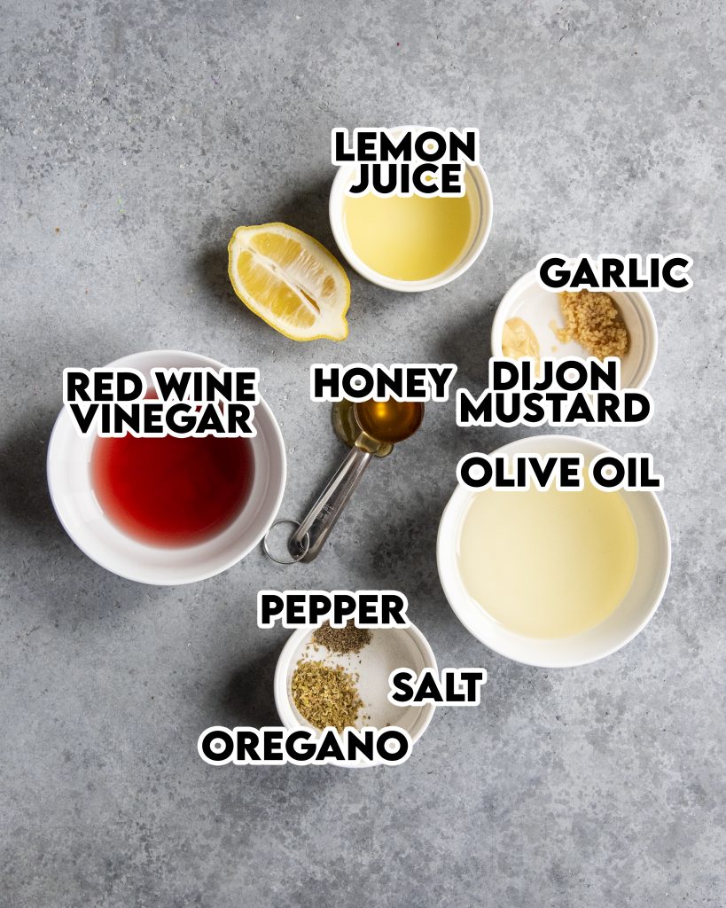 An overhead photo of the ingredients needed to make red wine vinaigrette.