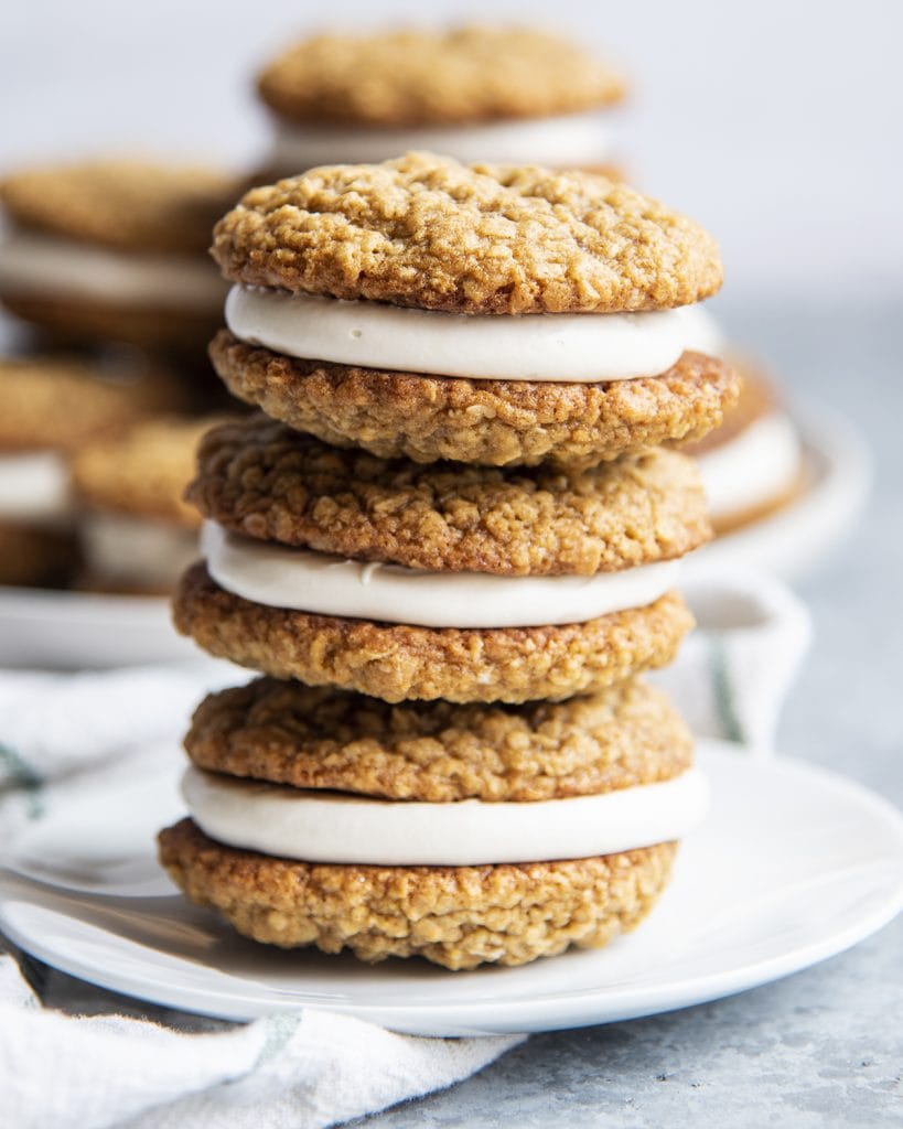 A stack of three oatmeal cream pie cookie sandwiches.