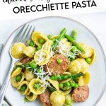 A plate of pesto orecchiette pasta with a text block over the top for pinterest.