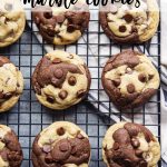 An overhead photo of a cooling rack topped with rows of chocolate chip marble cookies, with a text overlay for pinterest.
