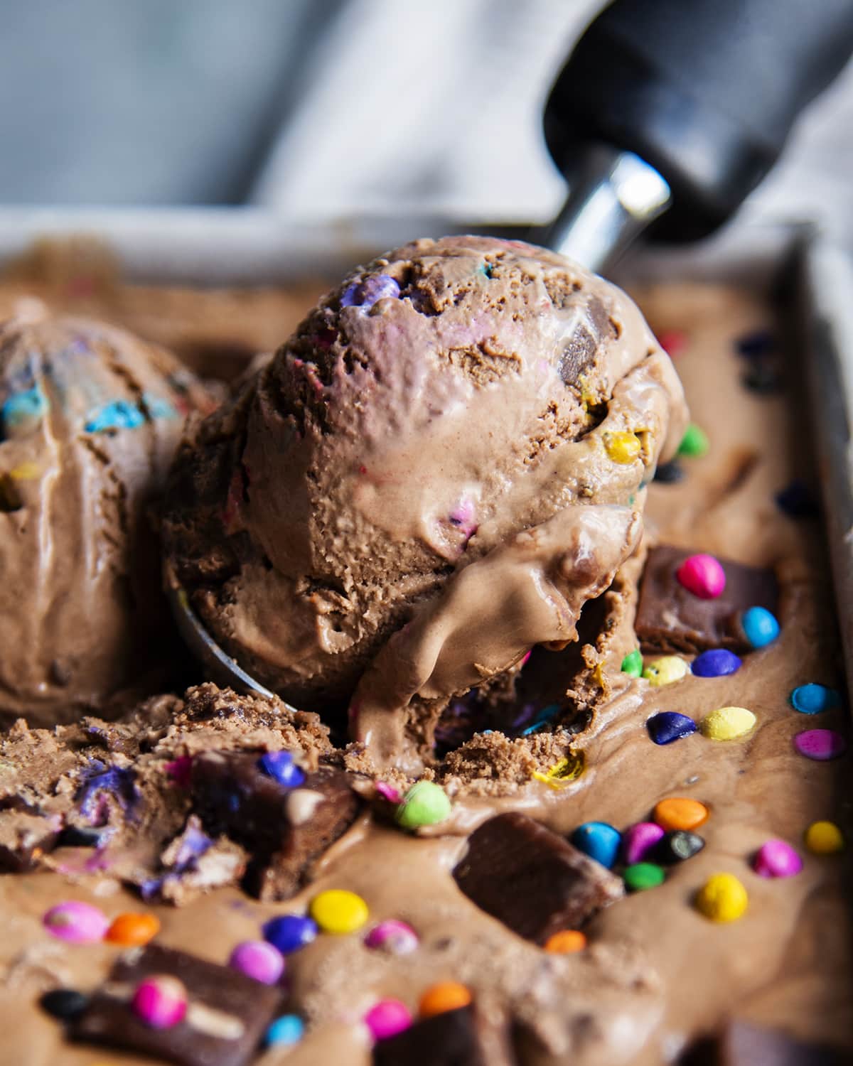 A close up of a scoop of cosmic brownie ice cream.