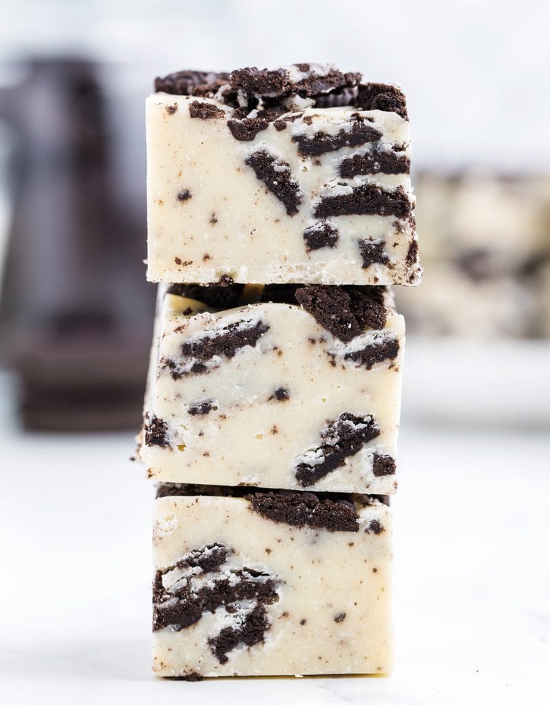 A stack of 3 pieces of Oreo Fudge made with white chocolate and Oreos.