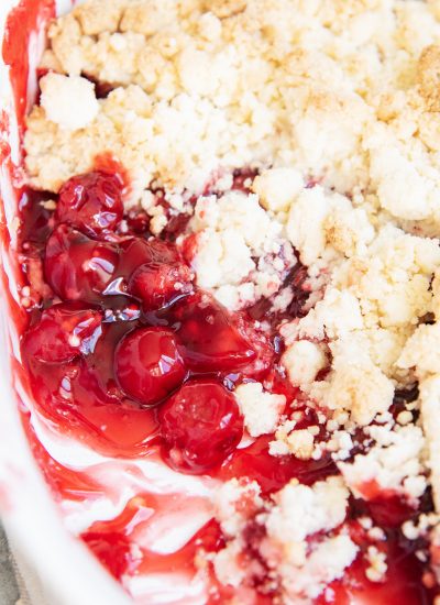 A cake mix cherry cobbler in a baking pan.